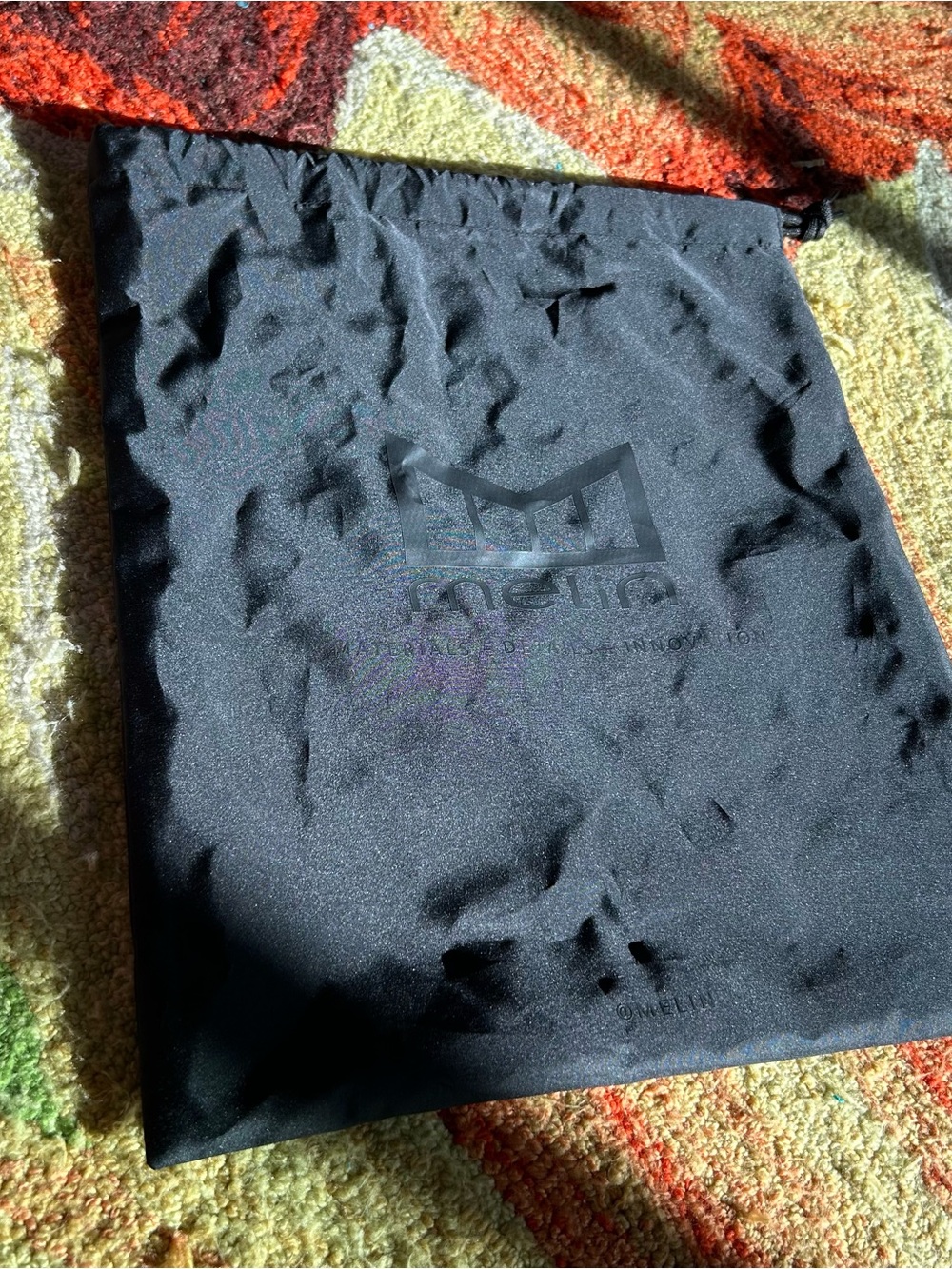 Melin Black Drawstring Hat Sleeve Bag